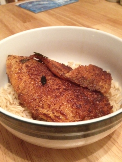 Pan-fried tilapia served on brown rice. This is what it should look like when you're done.